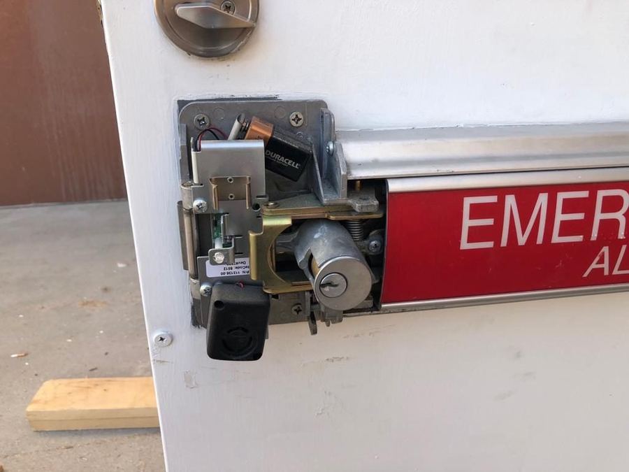 Exit device and lock cylinder repair on an emergency door