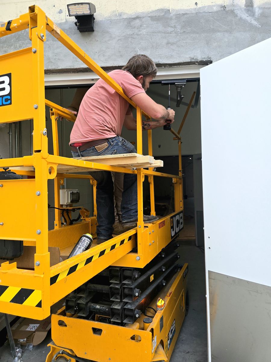 Working on door hardware from a lift