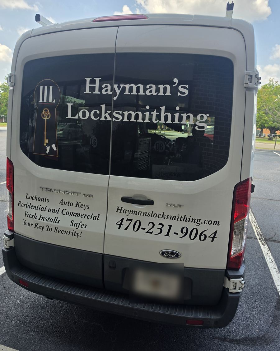 Rear doors of the Hayman’s Locksmithing van with website and phone number