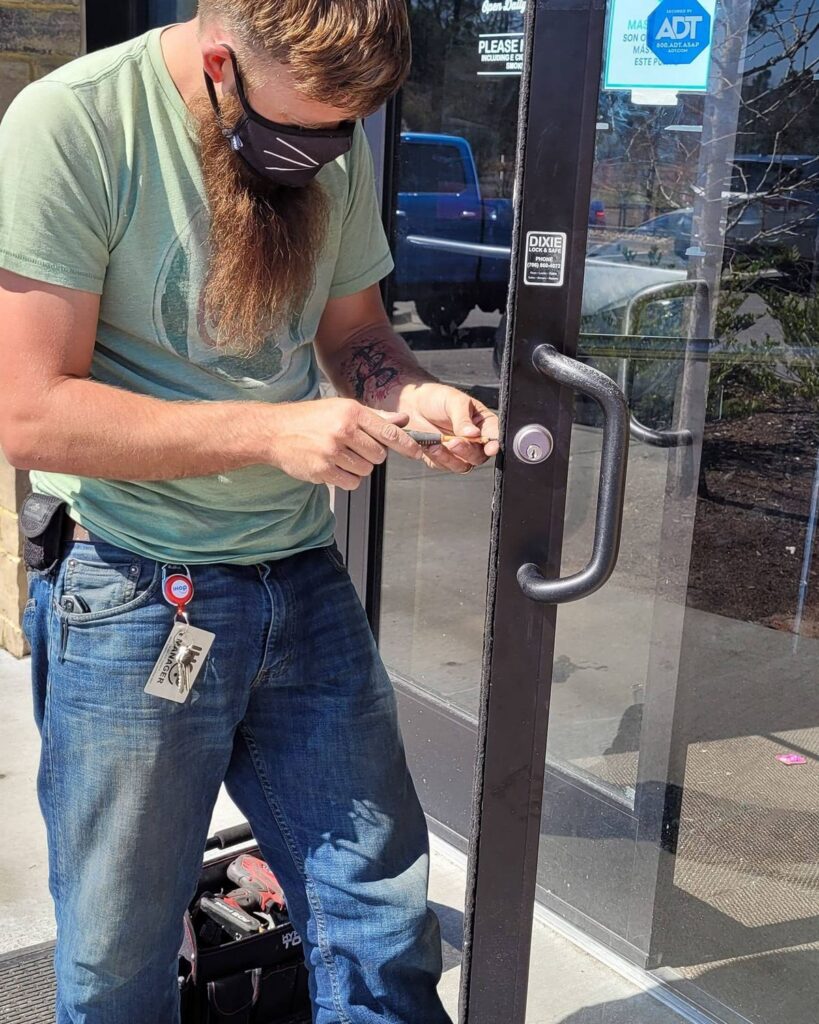 Servicing the lock on a glass storefront door