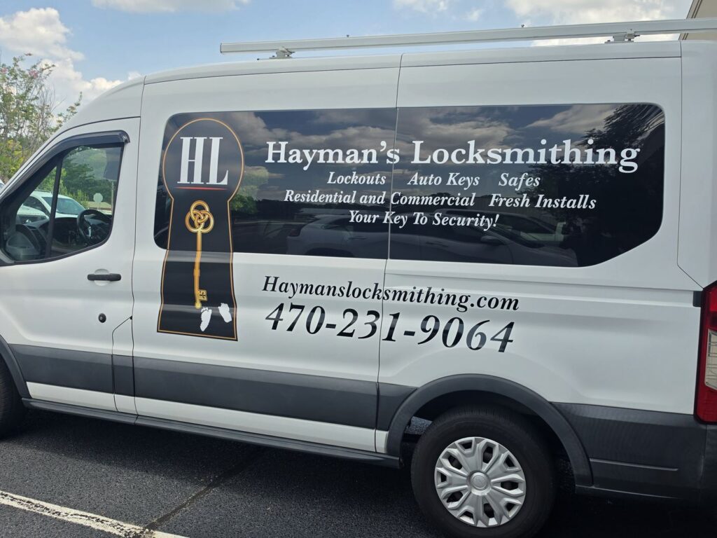 Driver side of the Hayman’s Locksmithing van: Lockouts, Auto Keys, Safes, Residential and Commercial, Fresh Installs